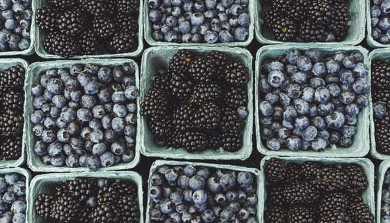 black berries on black surface