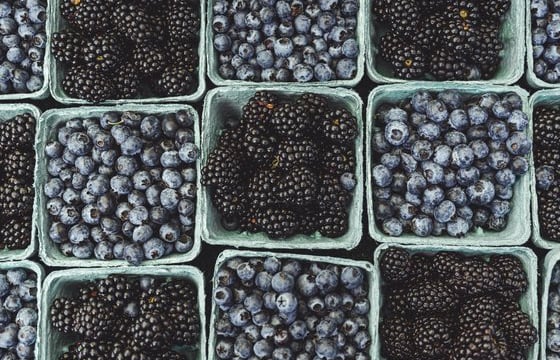 black berries on black surface