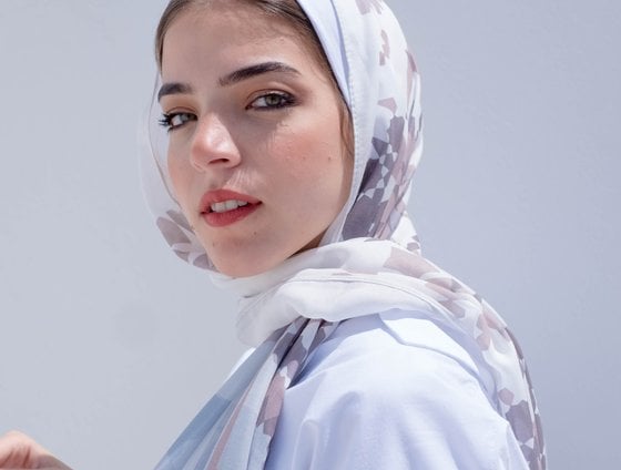 woman in white hijab smiling