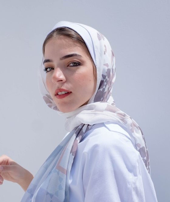 woman in white hijab smiling