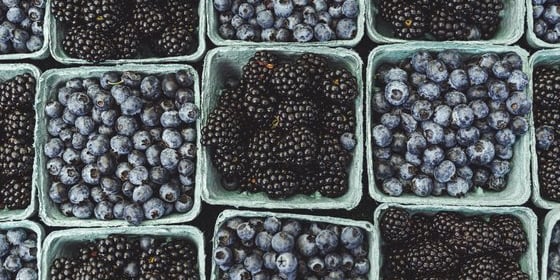 black berries on black surface