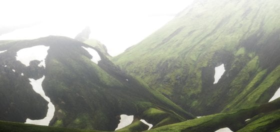 green mountain under white sky during daytime