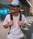 man in white crew neck t-shirt wearing blue cap and black sunglasses