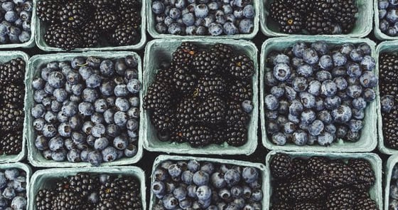 black berries on black surface