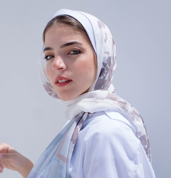 woman in white hijab smiling