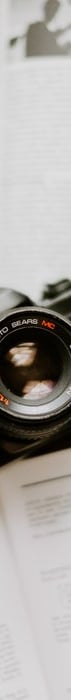 black nikon dslr camera on white printer paper