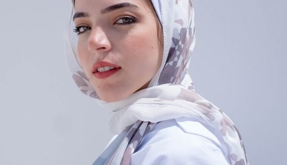 woman in white hijab smiling