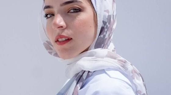 woman in white hijab smiling