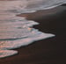 ocean waves crashing on shore during daytime