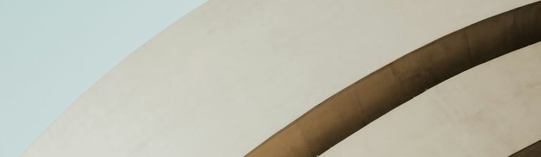 woman standing in front of white building