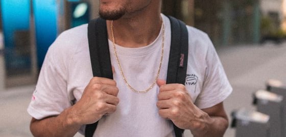 man in white crew neck t-shirt wearing blue cap and black sunglasses