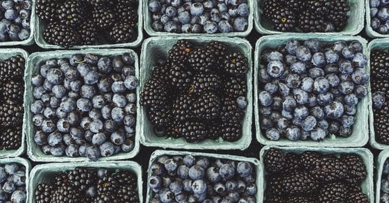 black berries on black surface