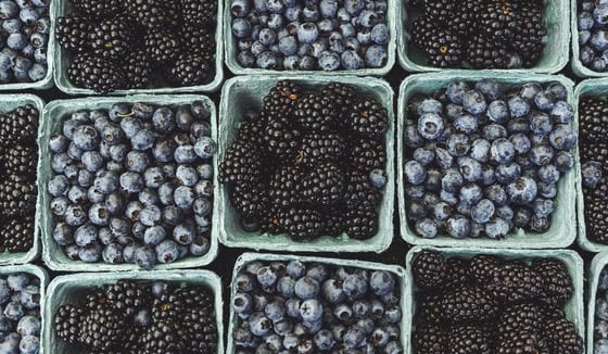 black berries on black surface