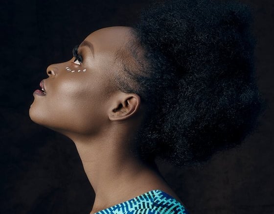 woman in blue and white shirt