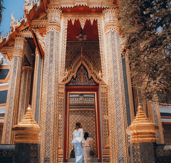 man and woman standing in front of brown concrete building during daytime