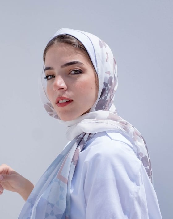 woman in white hijab smiling