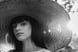 woman in white crew neck shirt wearing brown sun hat