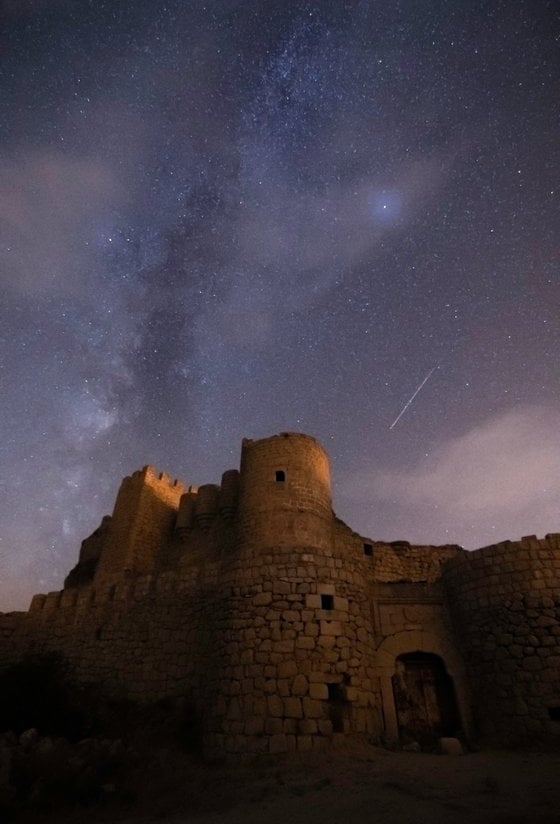 brown concrete building under starry night