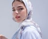 woman in white hijab smiling