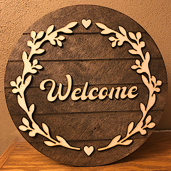 Welcome sign with laurel wreath