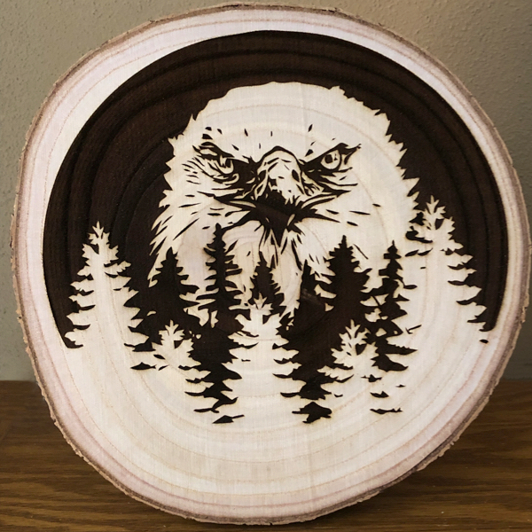 Eagle (front view) on paulownia slice