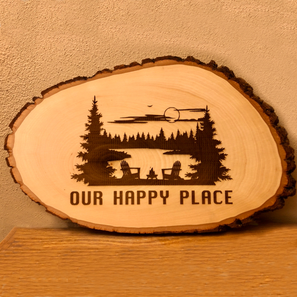 Our happy place sign engraved on basswood with bark