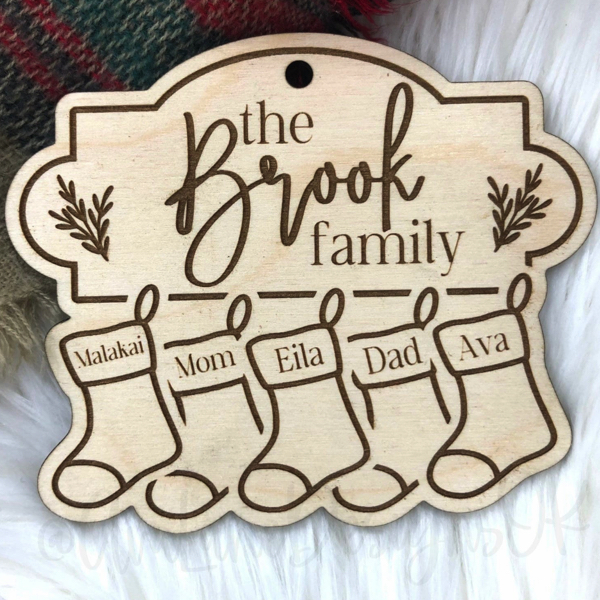 Personalized family sign with stockings for each member of the family (don't forget your pet!)