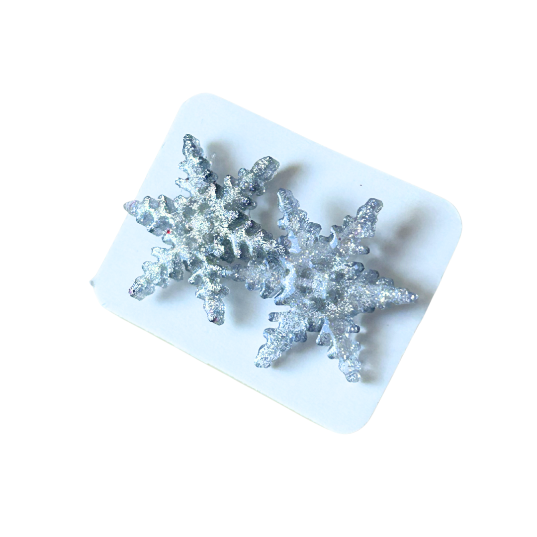 Aretes navideños copos plateados