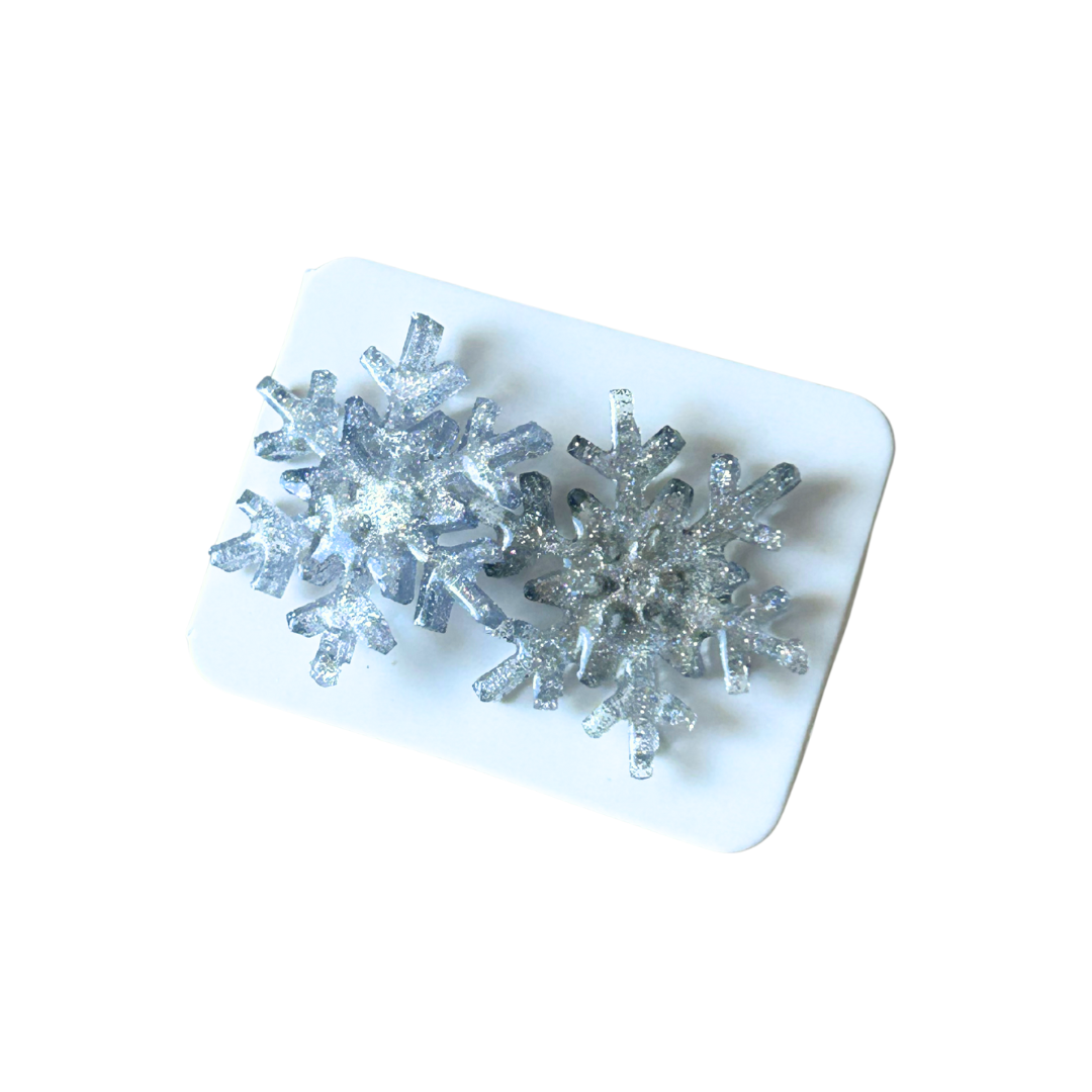 Aretes navideños copos plateados