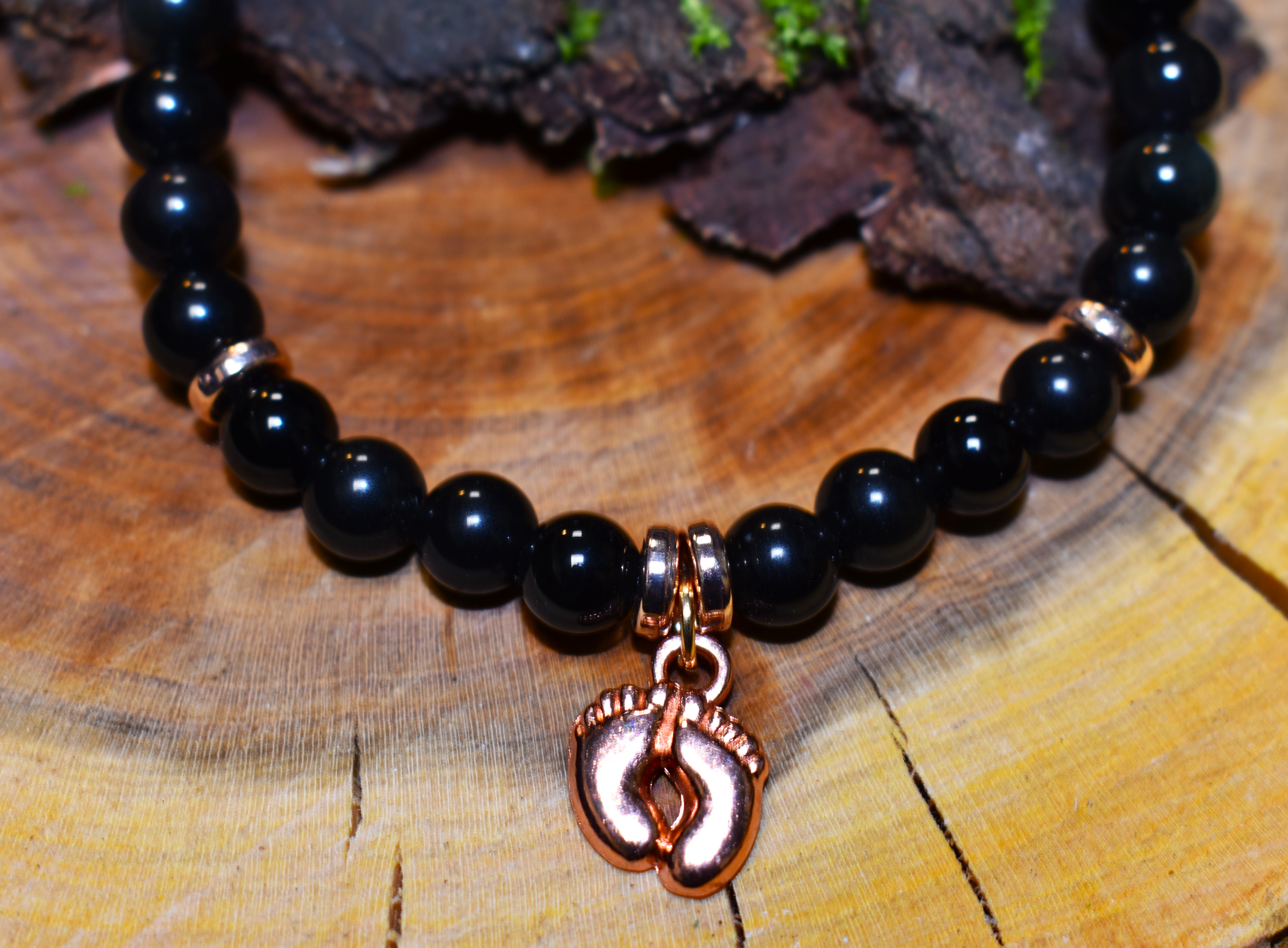 Bracelet Obsidiennes et petits pieds rose dorés