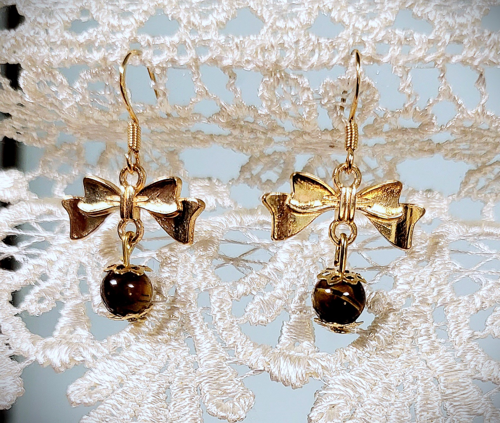 Boucles d'oreilles noeuds dorés