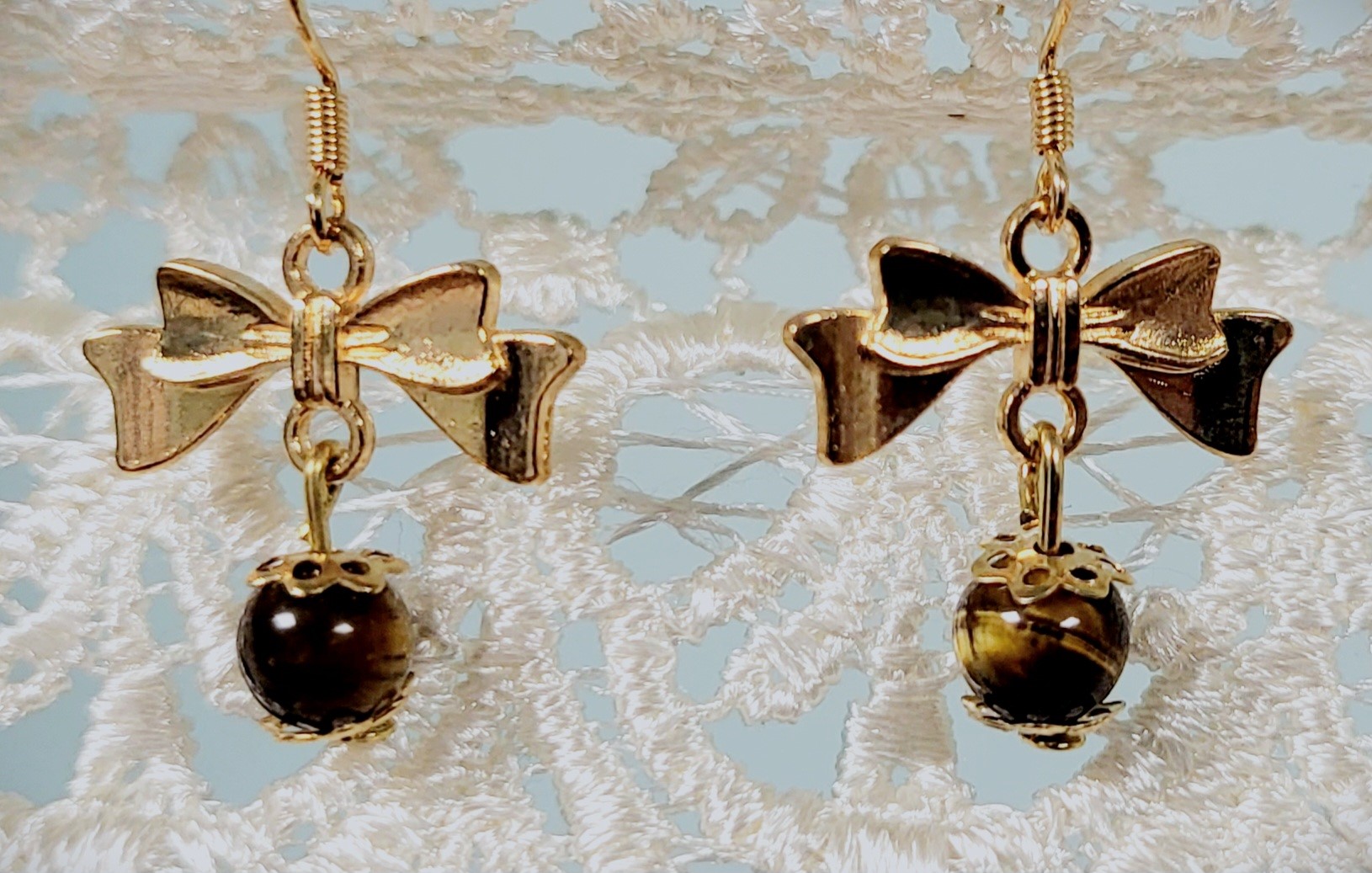 Boucles d'oreilles noeuds dorés 