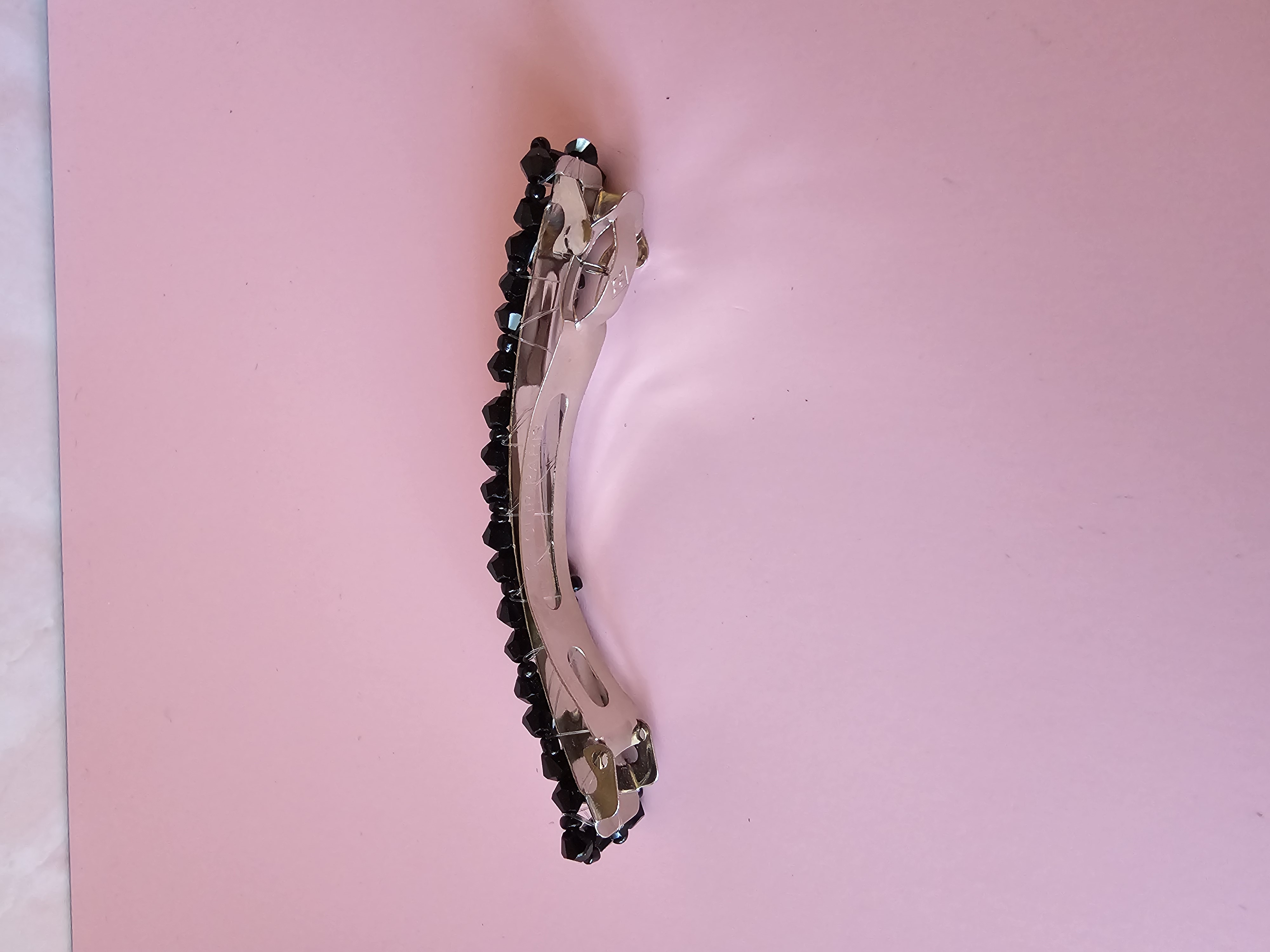 Blizgus juodas plaukų segtukas