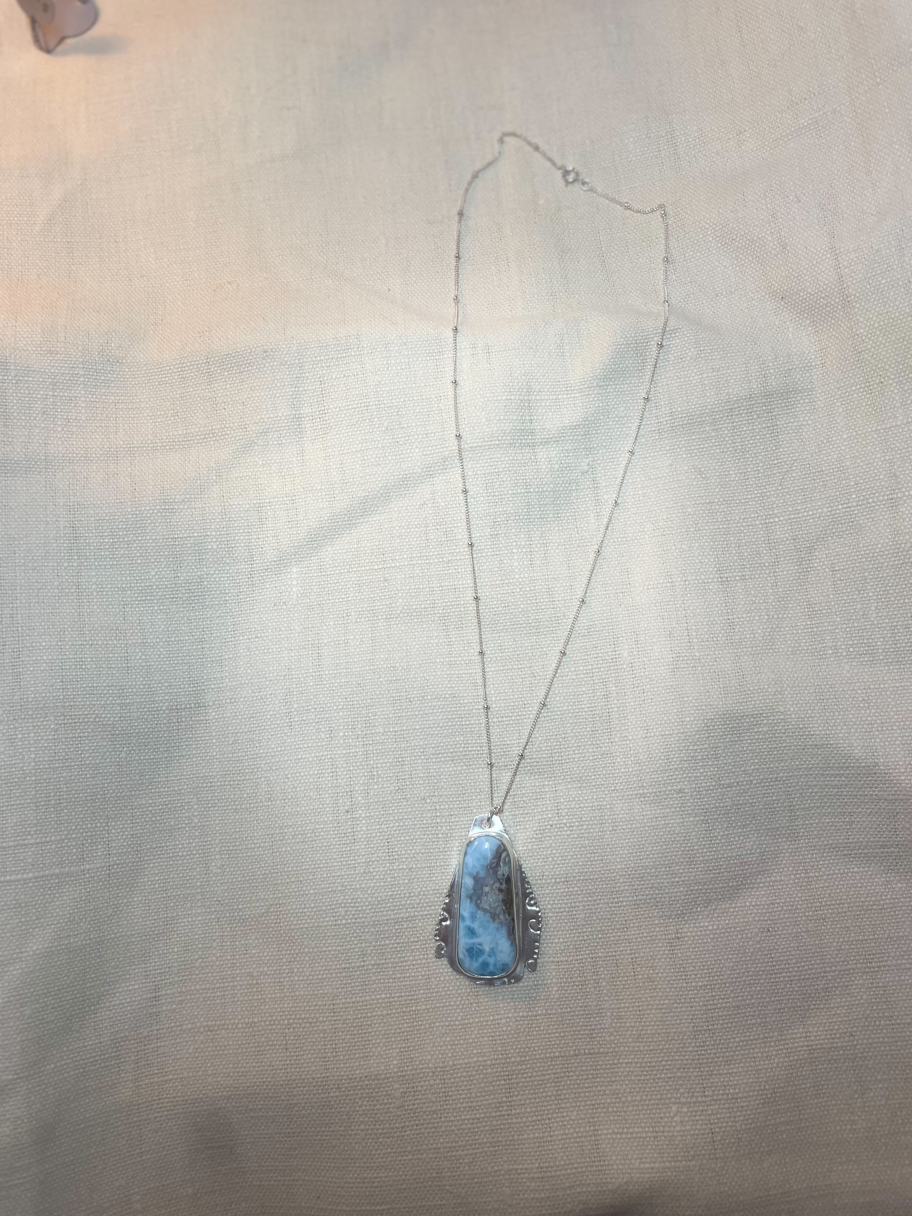 "Copper Embossed" Larimar Pendant with Natural Red Feature in Sterling Silver