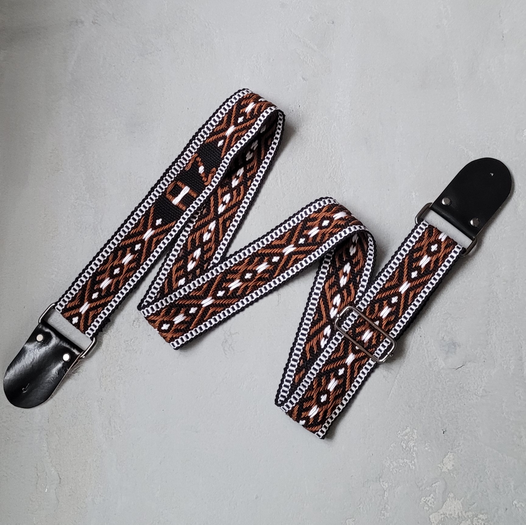 Gitaros diržas Inicialai