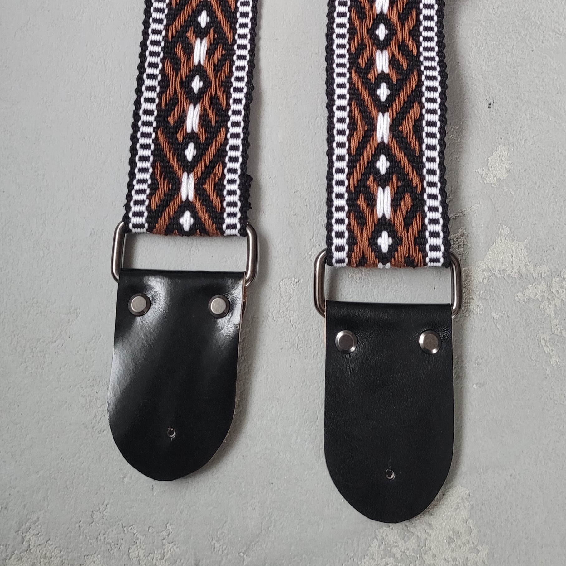 Gitaros diržas Inicialai