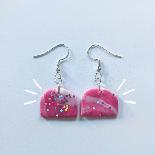 pink swirl glittery earrings