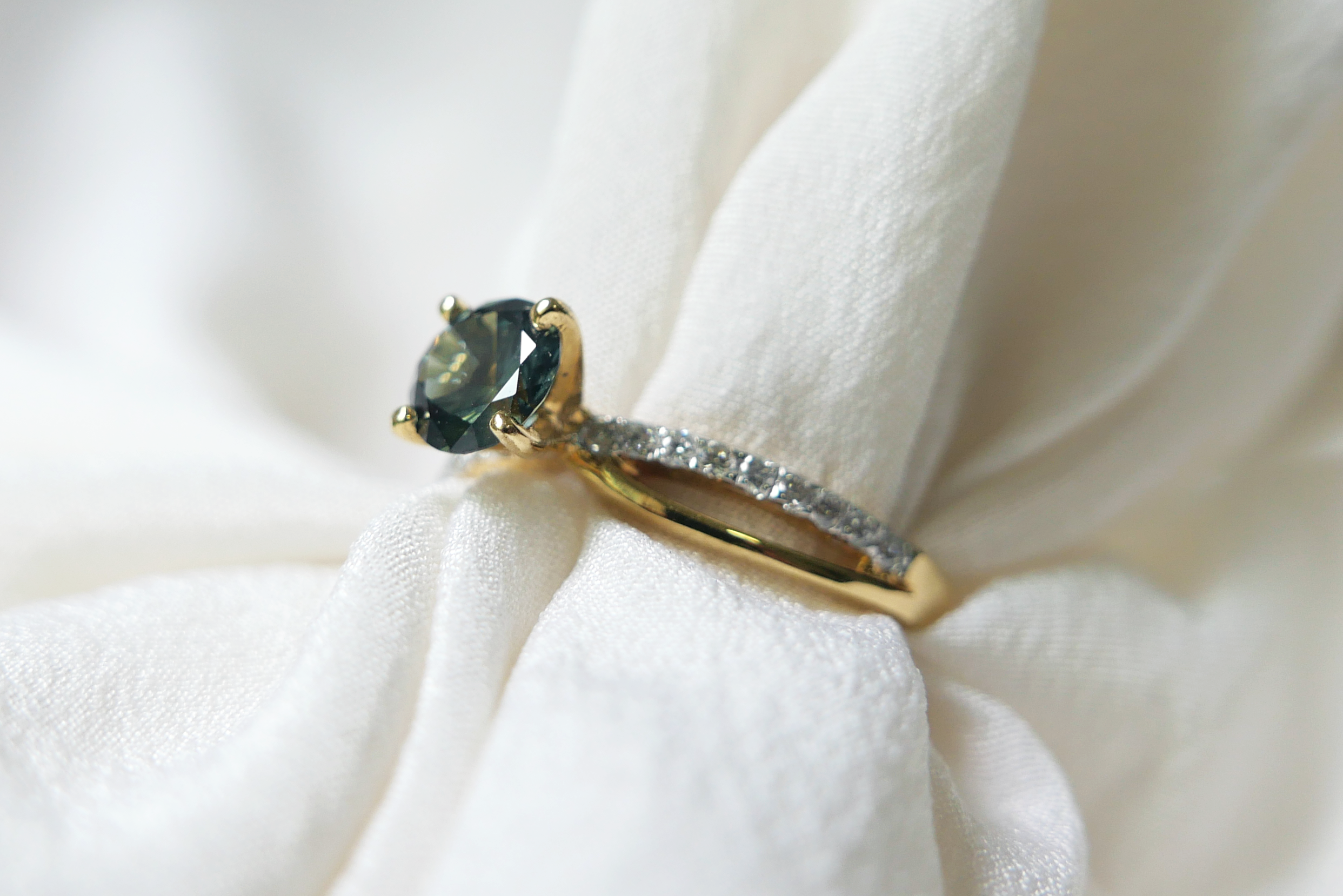 Unheated Teal Sapphire on Twist Diamond Pave Band