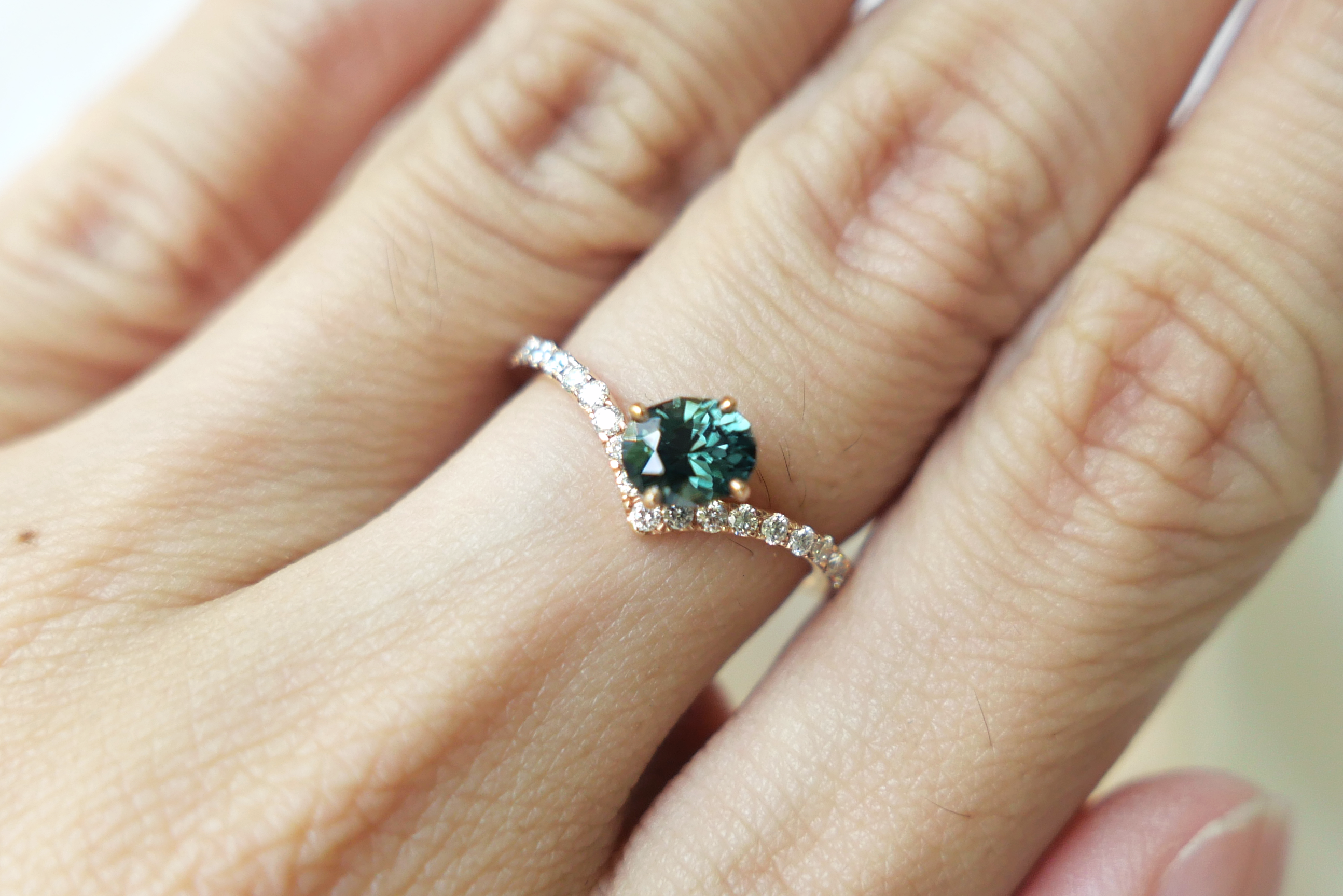 Oval Cut Dark Teal Green Sapphire in Diamond Pave Peak Band Ring