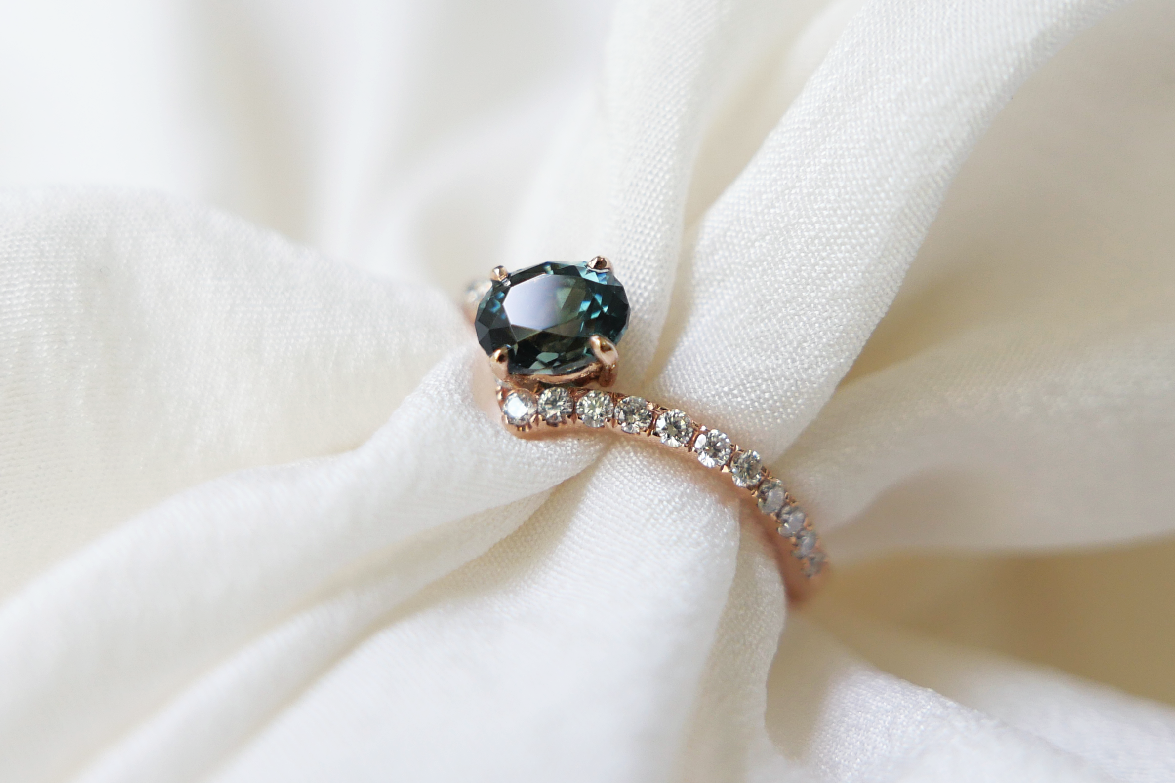 Oval Cut Dark Teal Green Sapphire in Diamond Pave Peak Band Ring