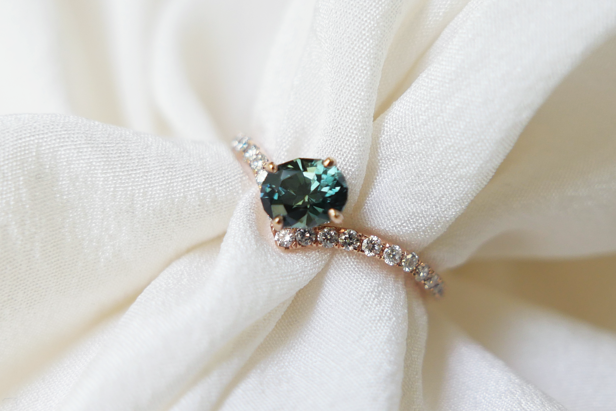 Oval Cut Dark Teal Green Sapphire in Diamond Pave Peak Band Ring