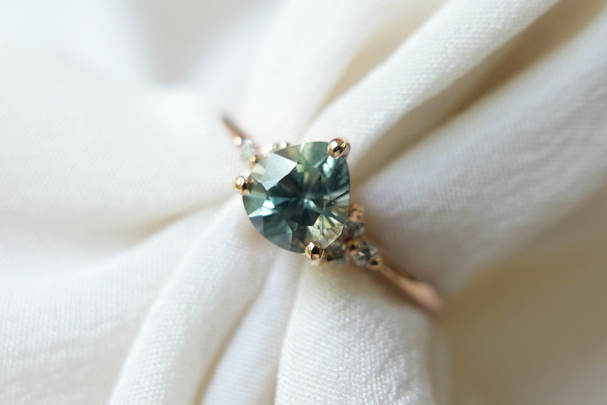 Pear Shaped Sapphire with a Trio of Diamonds