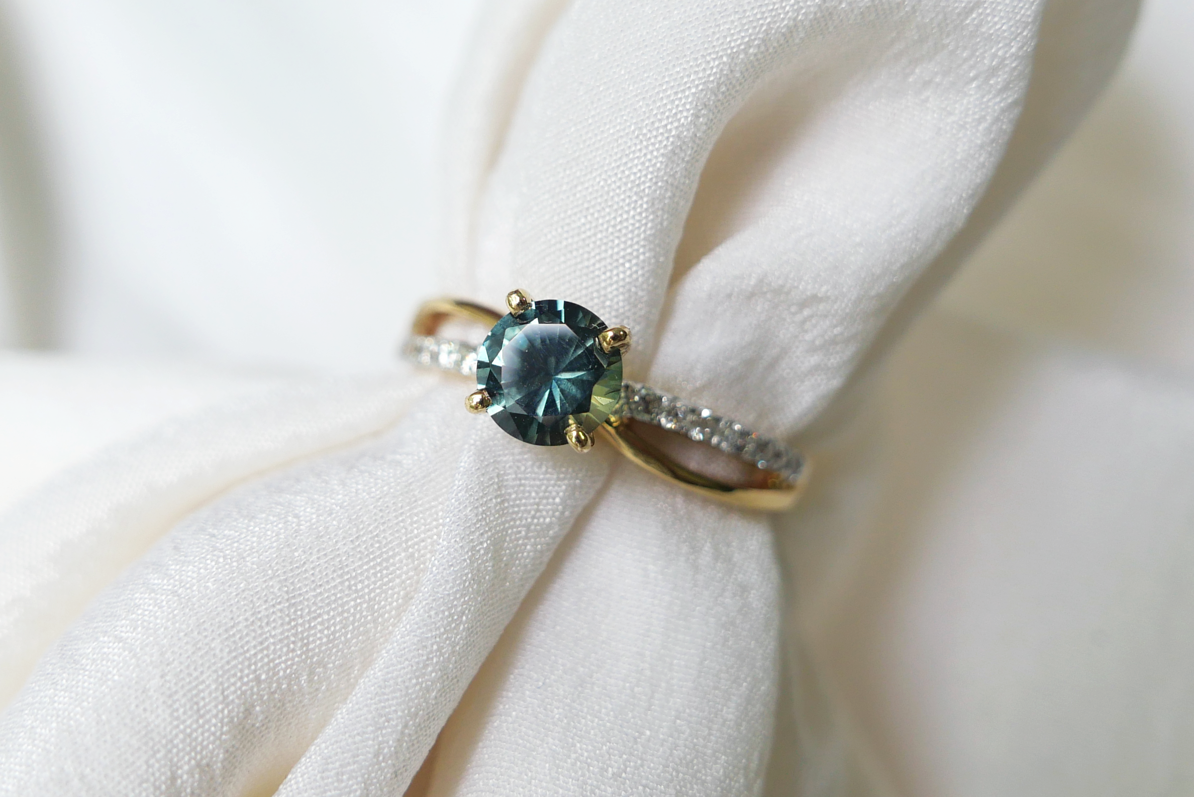Unheated Teal Sapphire on Twist Diamond Pave Band