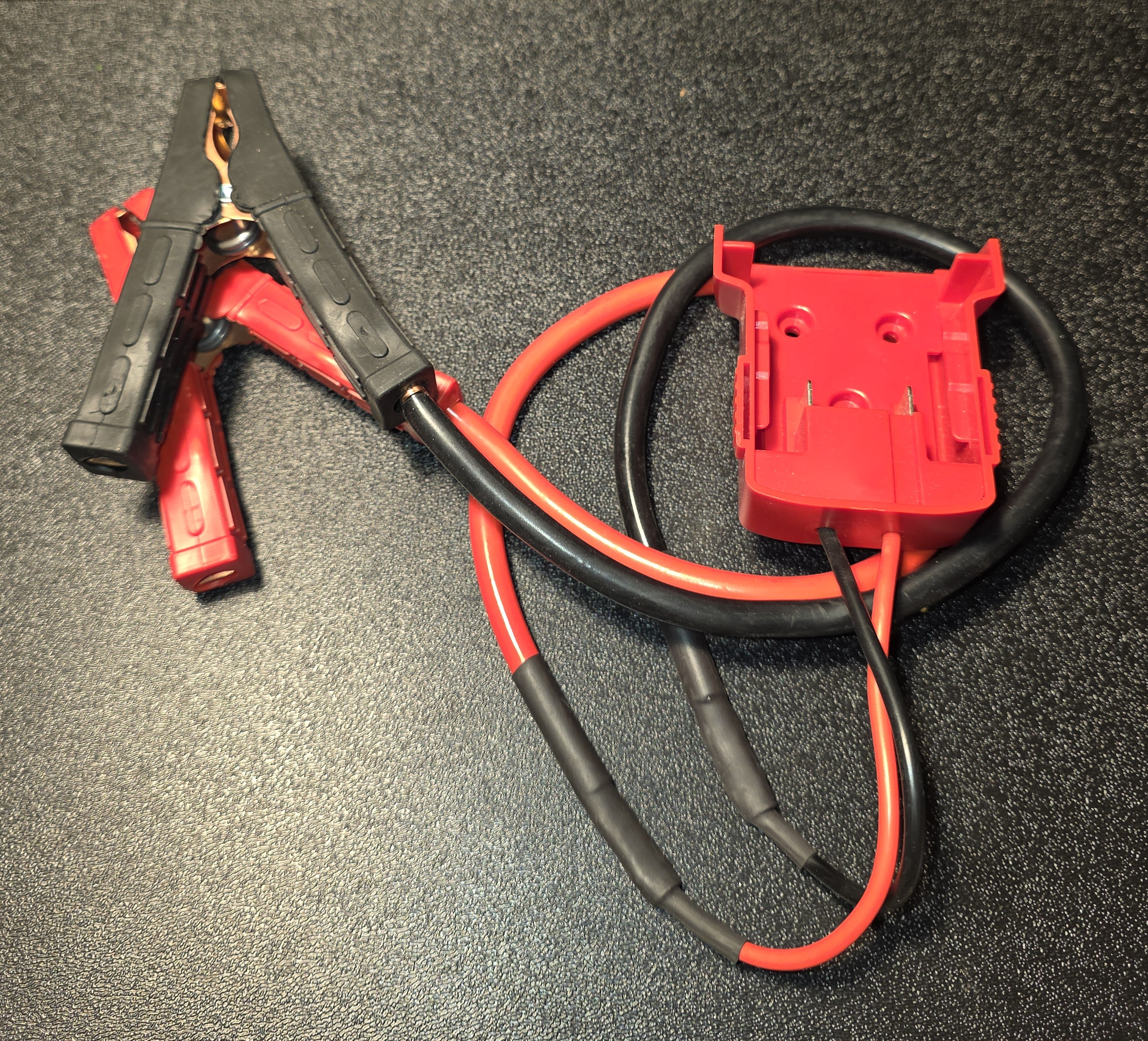 "Milw Red" jump start pack.   Requires "Milw Red" 18 volt lithium ion battery pack.