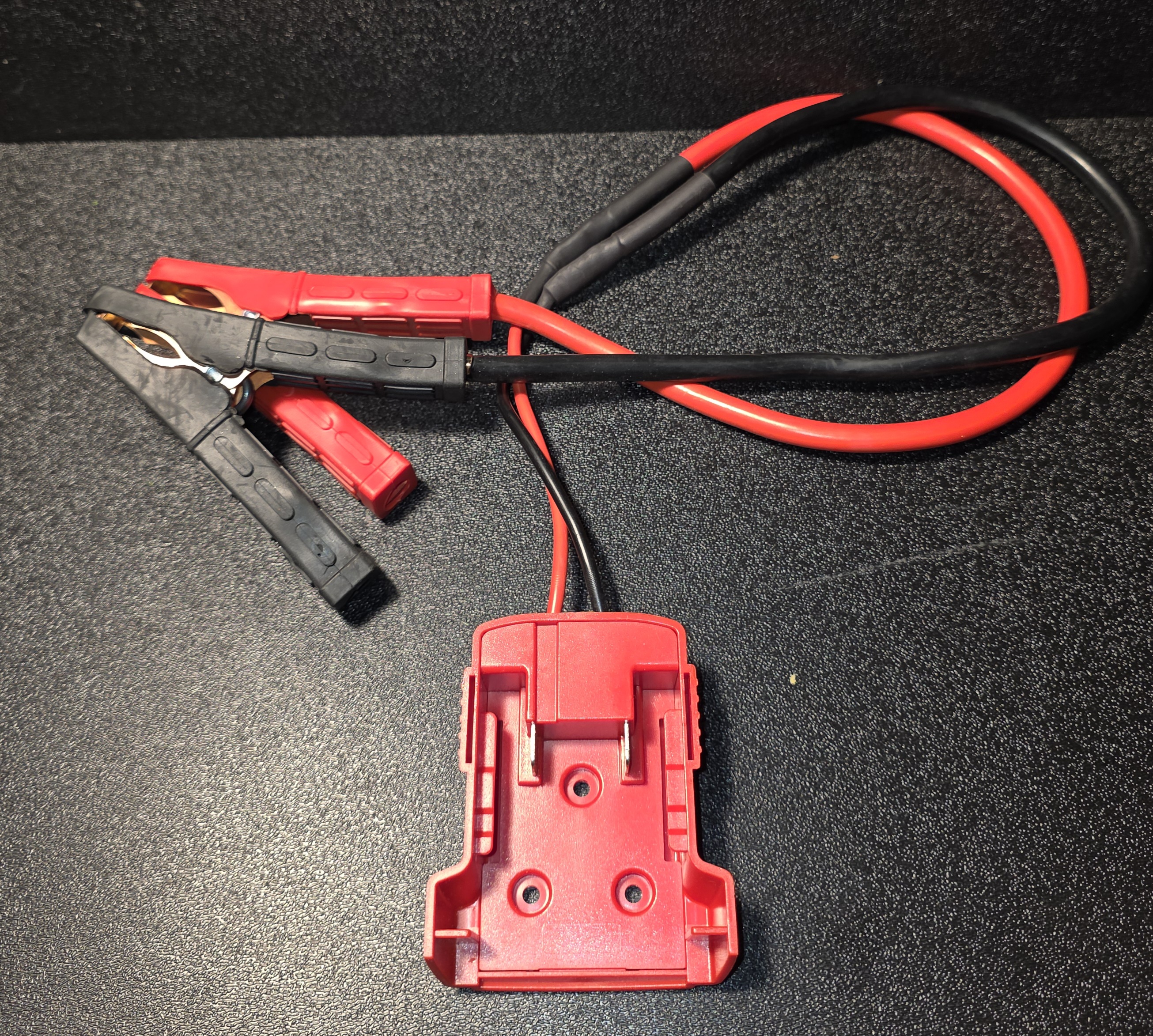 "Milw Red" jump start pack.   Requires "Milw Red" 18 volt lithium ion battery pack.