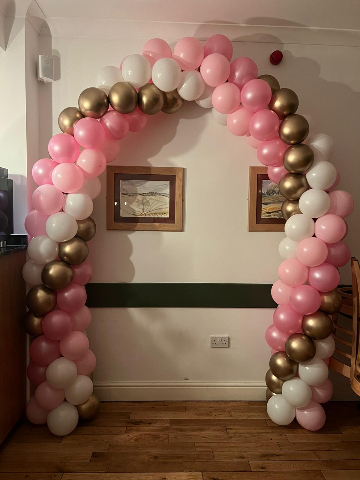 Spiral Balloon Arch (Indoors) in Pink, White and Gold colours