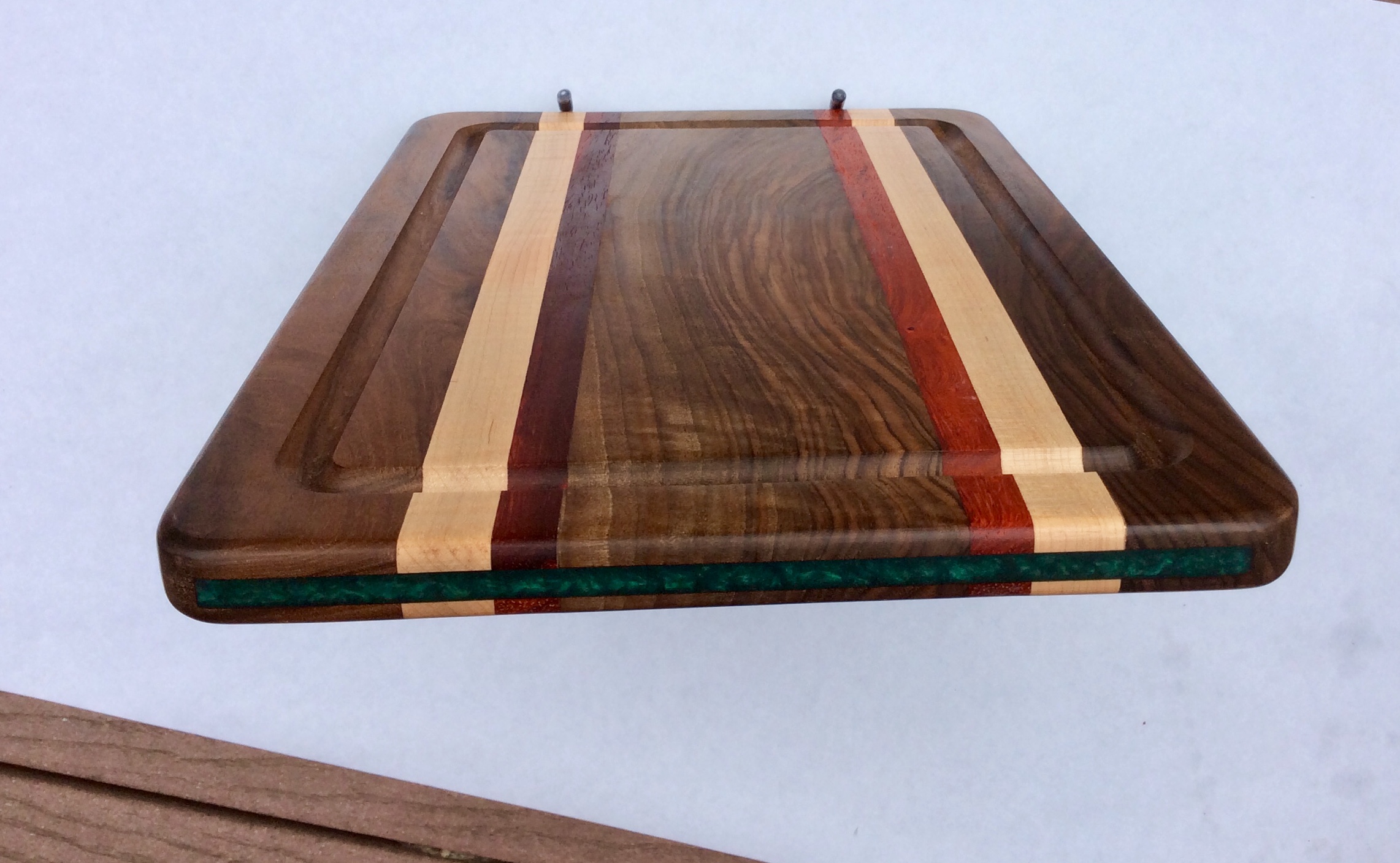 Walnut striped cutting board with green trim