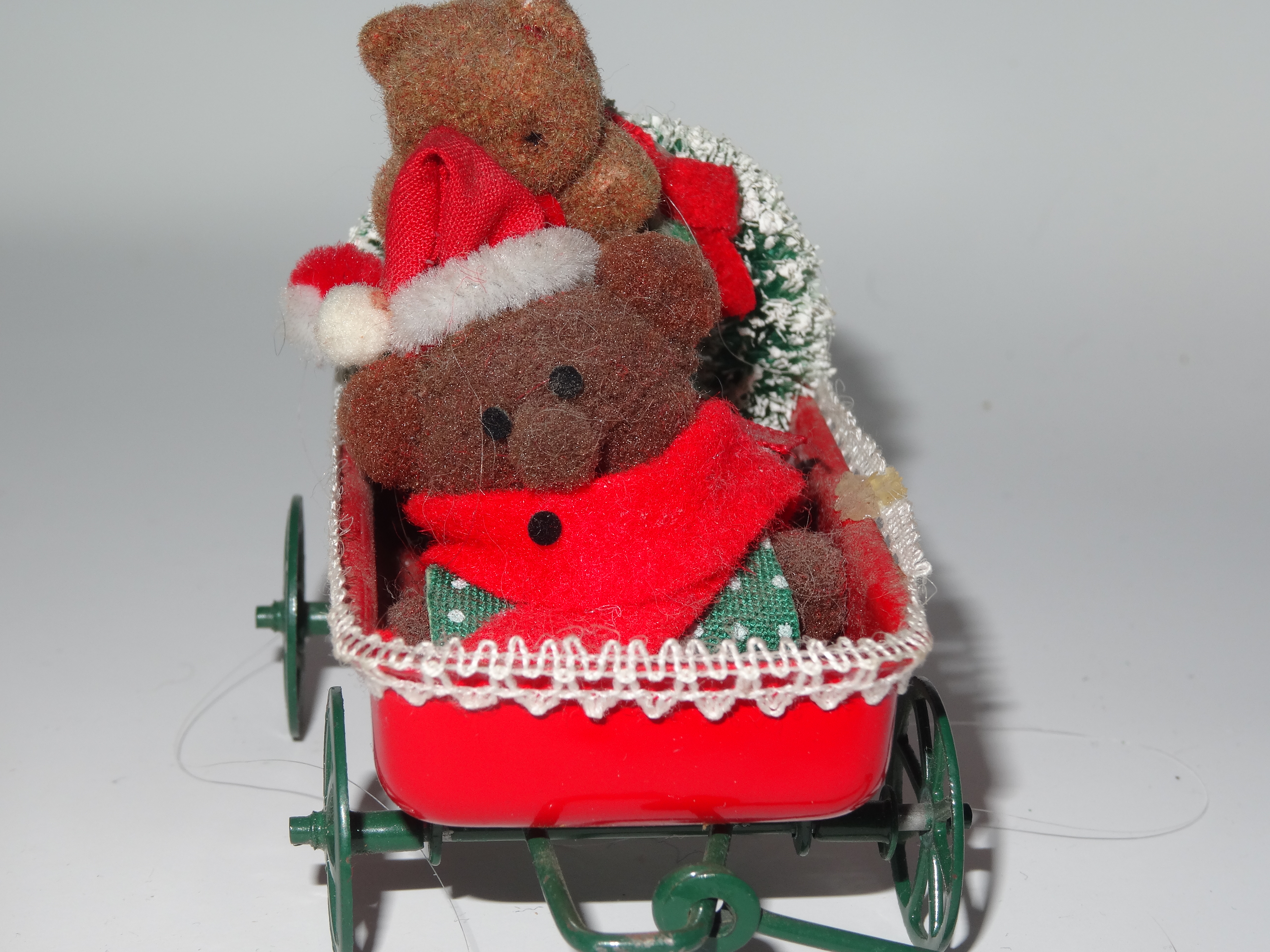 Two bears in a Christmas wagon