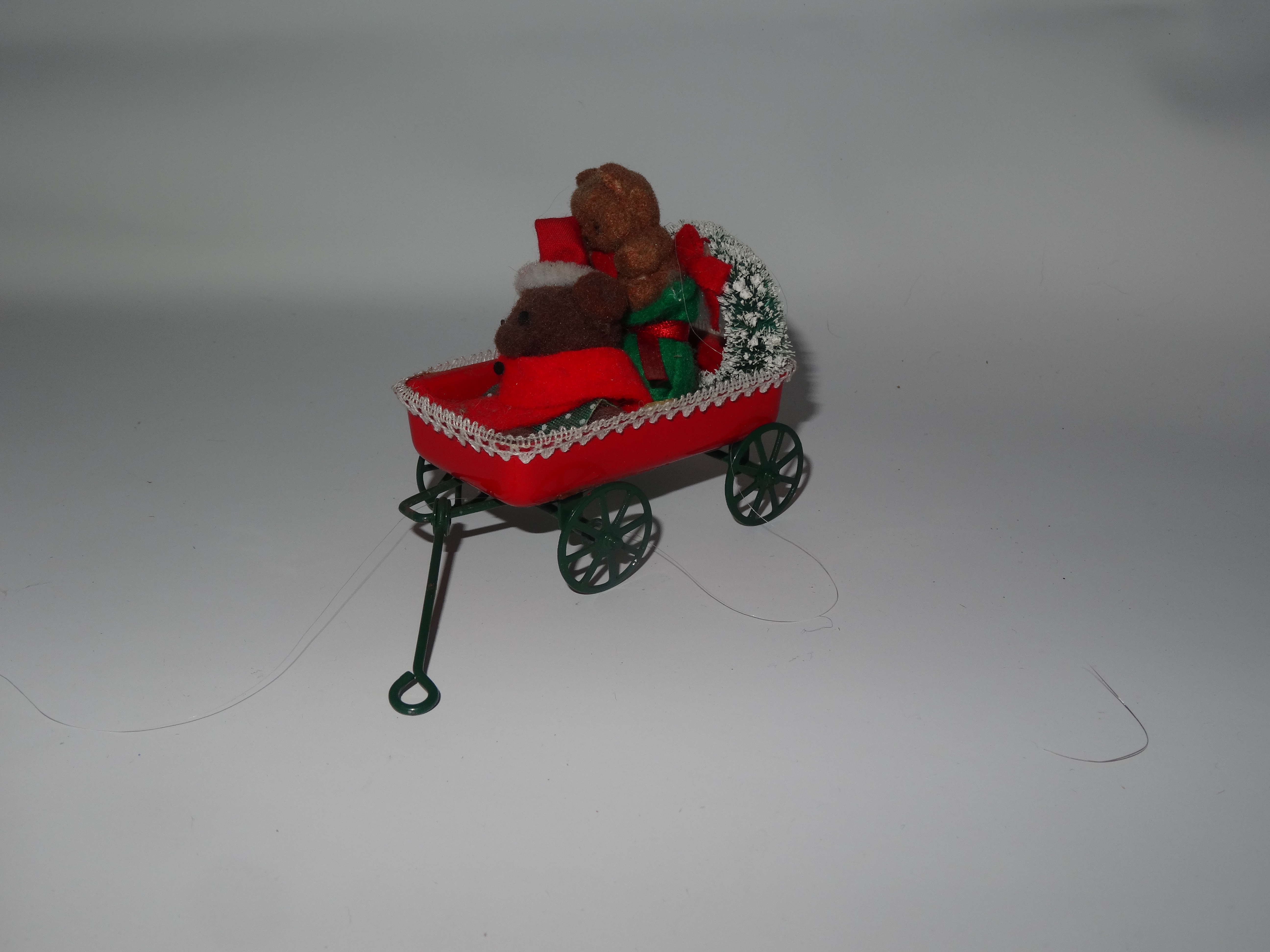 Two bears in a Christmas wagon