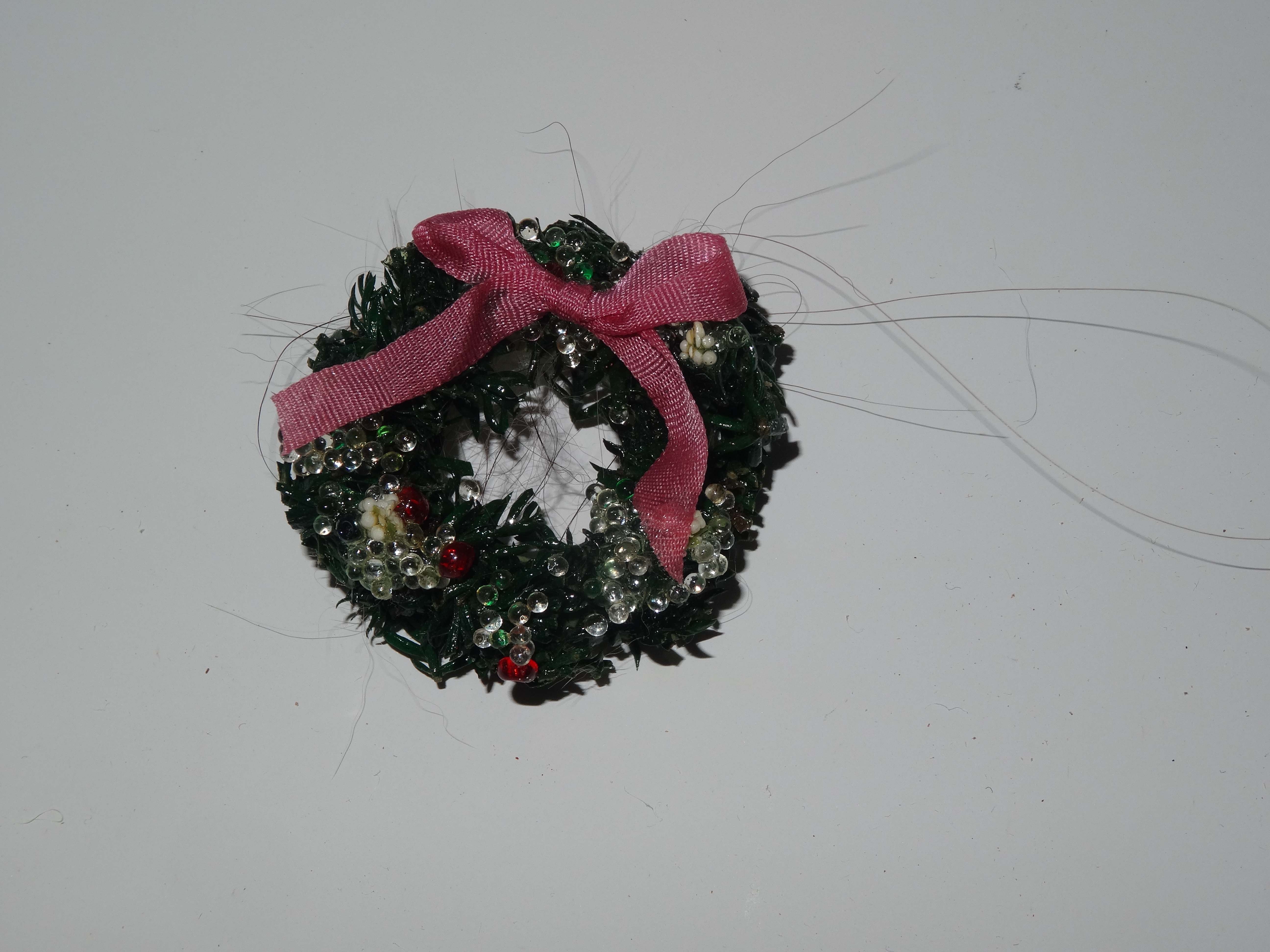 Holiday wreath with pink bow